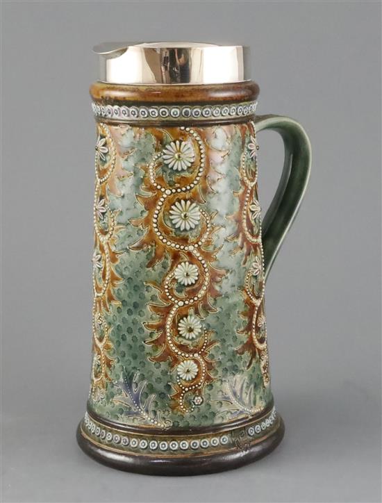 George Tinworth for Doulton Lambeth, a ewer of scroll and flowerhead design, dated 1879, H. 24.5cm